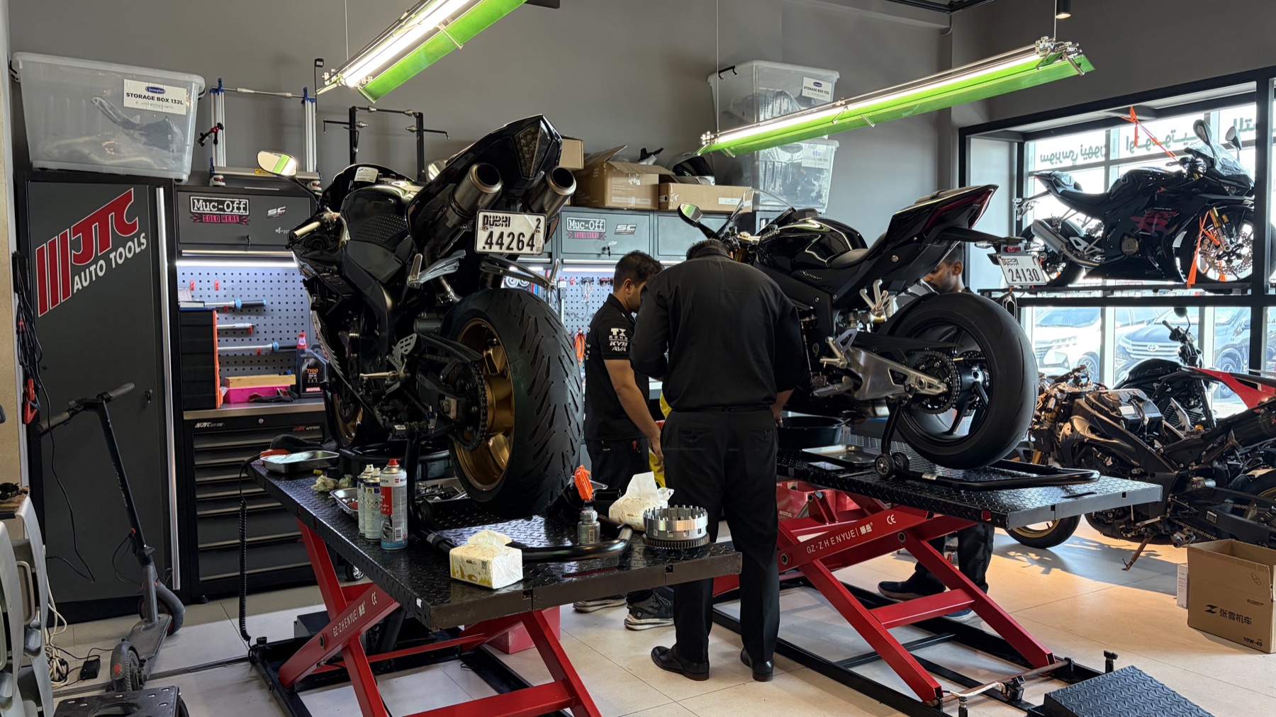 Super C Moto workshop team servicing motorcycles in Ras Al Khor